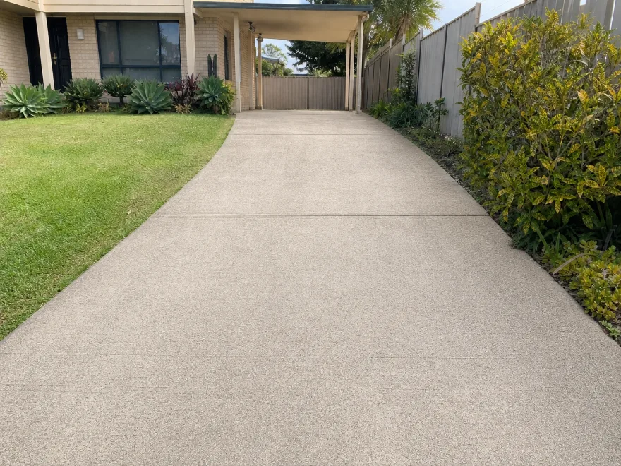 Concrete driveway after pressure washing, grime lifted