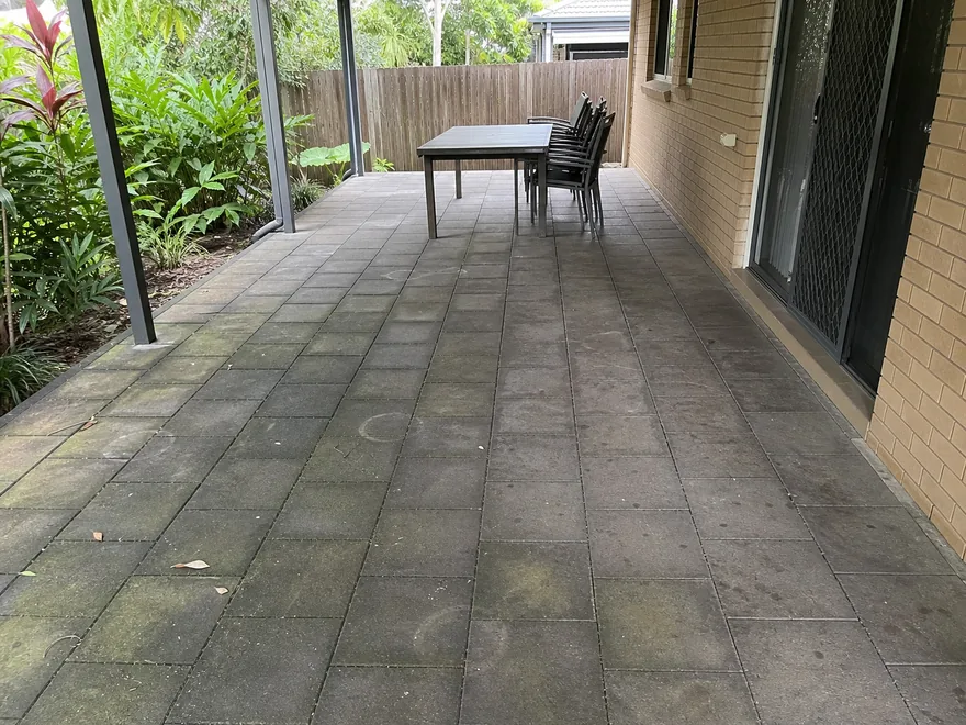 Same covered Brisbane patio before pressure washing, with mildew, algae and ingrained dirt